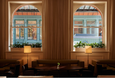 An intimate shot of the lobby seating area and two large windows at The Mercer