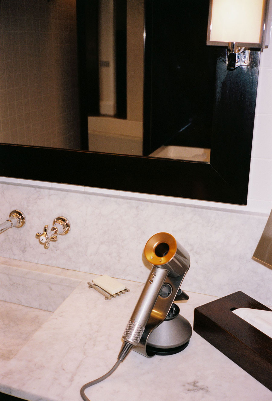 Photo of a complimentary dyson hairdryer on a vanity counter